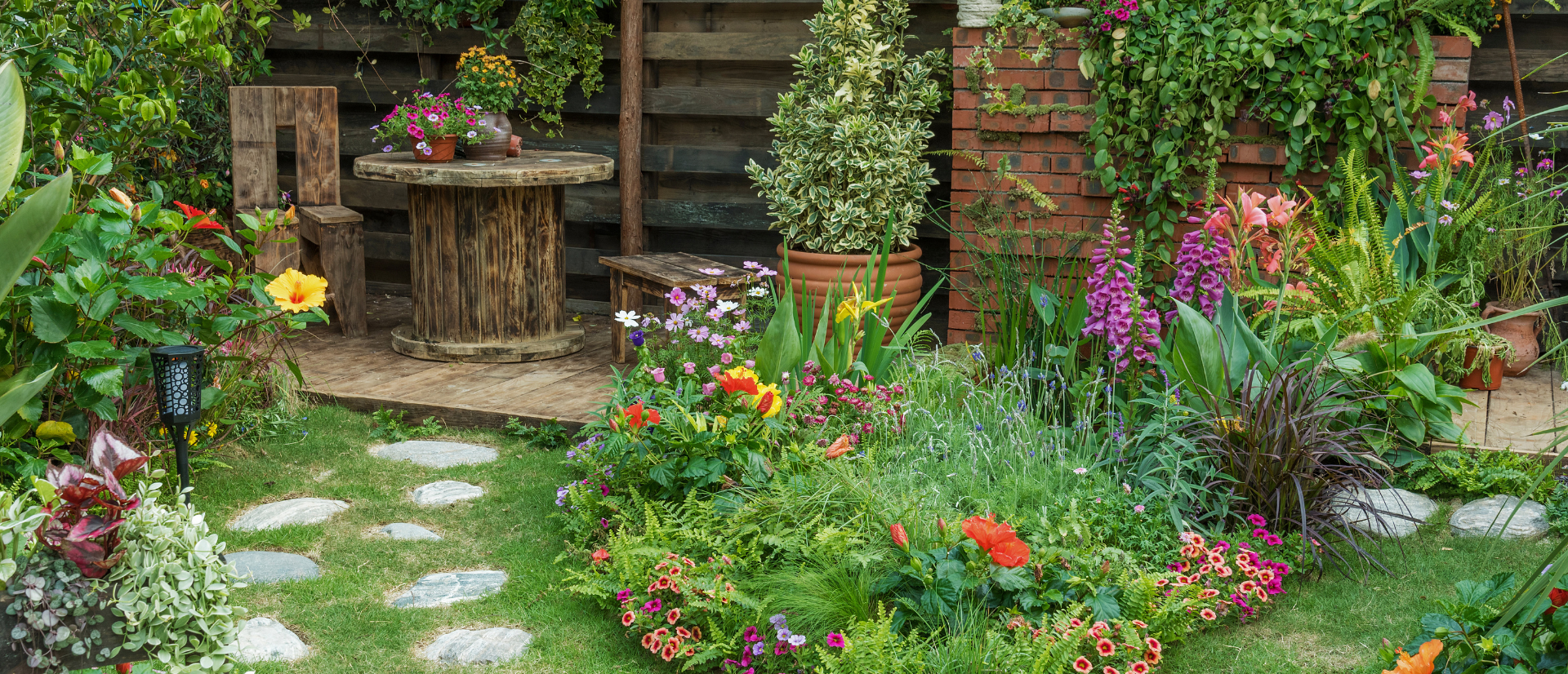 garden with stone path in front of house